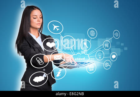Women using digital tablet and cloud with icons Stock Photo