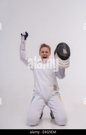 Young woman engaging in fencing Stock Photo