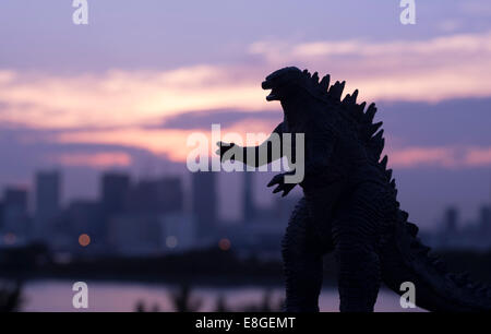 Godzilla ( toy )  looms over the Tokyo Bay, Odaiba, Tokyo, JAPAN. Stock Photo