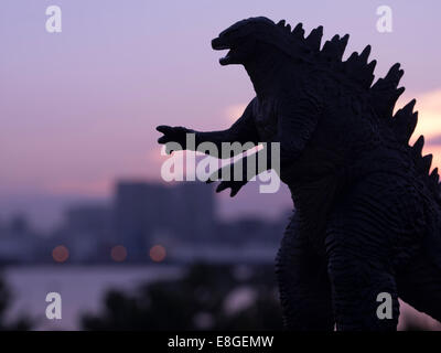 Godzilla ( toy )  looms over the Tokyo Bay, Odaiba, Tokyo, JAPAN. Stock Photo