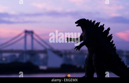 Godzilla ( toy )  looms over the Tokyo Bay, Odaiba, Tokyo, JAPAN. Stock Photo