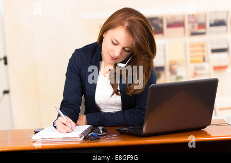 secretary using cell phone Stock Photo