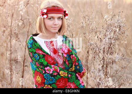 Portrait of young woman wearing traditional shawl