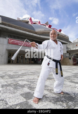 Masahiro Nakamoto - Hanshi 10th dan, Okinawa Dentou Kobudo with nunchaku outside the Budokan, Naha City, Okinawa Stock Photo