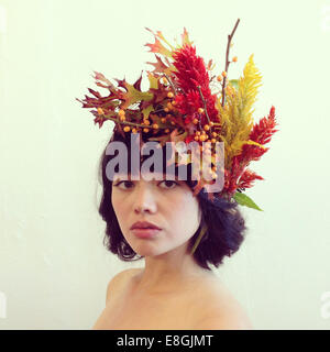 Portrait of a woman wearing a floral headdress Stock Photo