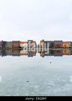 Reflection of multi coloured houses in lake, Peblinge Dossering, Copenhagen, Denmark Stock Photo