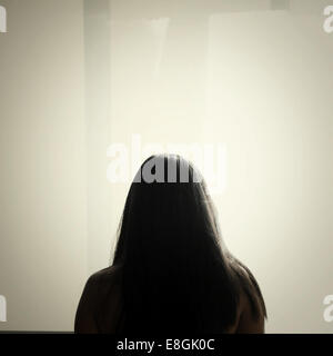 Rear view of woman with long hair Stock Photo