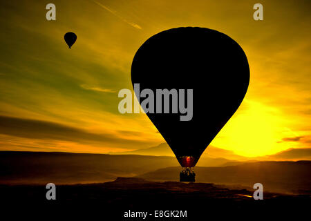 Silhouette of two hot air balloons at sunset, Avanos, Cappadocia, Anatolia, Turkey Stock Photo