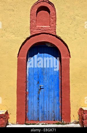 Colorful door at the church of Agia Triada ("Holy Trinity") close to Mytikas village, Xiromero, Aitoloakarnania, Greece Stock Photo
