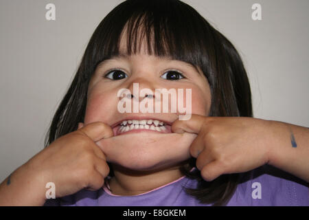 Girl pulling funny face Stock Photo