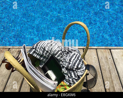 Beach bag by swimming pool