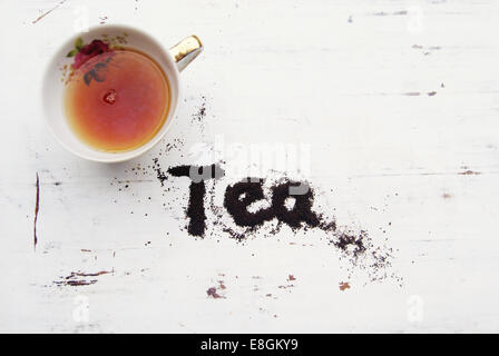 China tea cup with word tea spelled in tea leaves Stock Photo