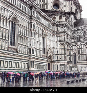 Italy, Tuscany, Florence, Tourists waiting in line to enter cathedral Stock Photo