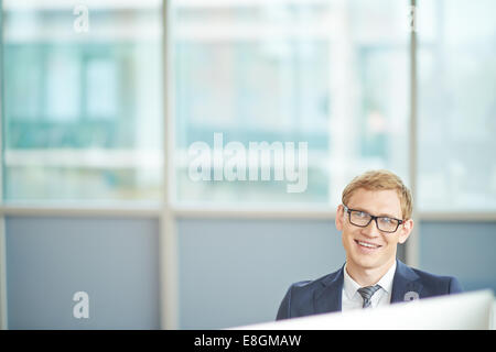Three colleagues talking in office Stock Photo