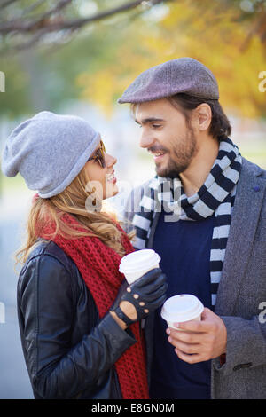 Couple drinking coffee outdoors Stock Photo