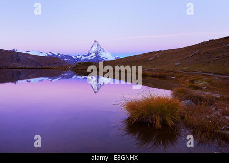 Matterhorn reflected in lake Stellisee, at dusk, Valais Alps, Canton of Valais, Zermatt, Switzerland Stock Photo