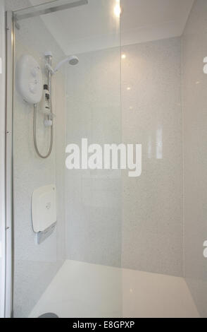 A white shower cubicle in a home in the UK. Stock Photo