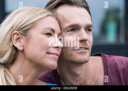 Thoughtful couple looking away outdoors Stock Photo