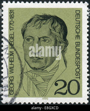 Stamp printed in Germany, shows a German philosopher, and a major figure in German Idealism, Georg Wilhelm Friedrich Hegel Stock Photo