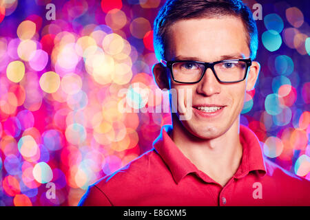 Portrait of a man in glasses smiling at camera Stock Photo
