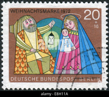 GERMANY - CIRCA 1972: Postage stamp printed in Germany (West Berlin), Christmas Issue, depicts The Holy Family, circa 1972 Stock Photo