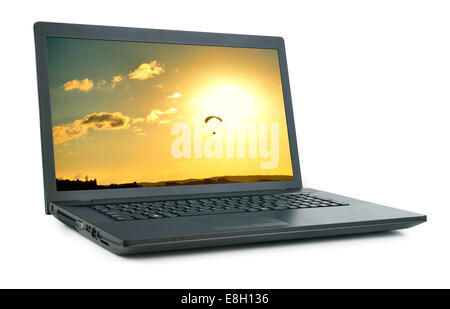 Laptop with picture of moto hang-glide. Isolated on white background Stock Photo