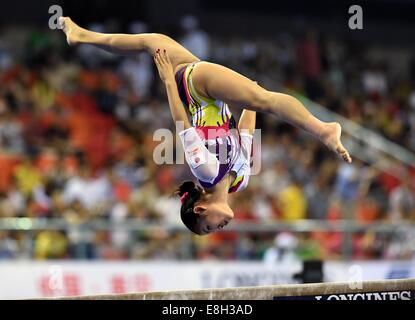 Japanese gymnast performs on women's vault during competition at 1984