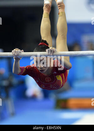 Jinnan Yao of China performs on the floor during the women's individual ...