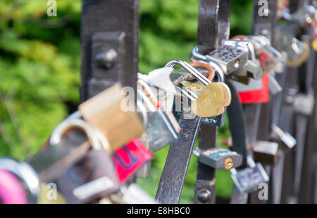 Locks of love, hanging on the railing of the bridge Stock Photo