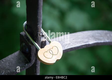 Lock of love, hanging on the railing of the bridge Stock Photo