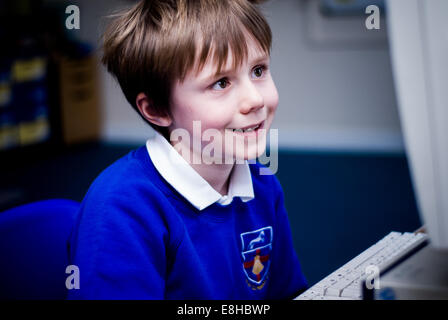 Schoolboy In IT Class Using Computer Stock Photo - Alamy
