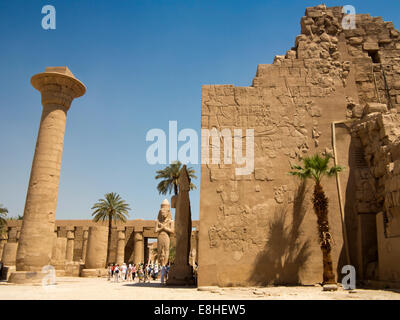 Egypt, Luxor, Karnak Temple, colossus of Rameses II, with Nefertiti at his feet Stock Photo