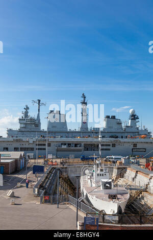 Newly decommissioned HMS Illustrious R06 an Invincible-class aircraft carrier at Portsmouth Naval base, and dry dock. Stock Photo