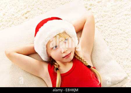 Smiling girl in Santa hat Stock Photo