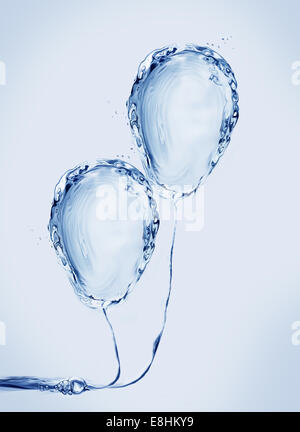 Two blue balloons made of water. Stock Photo