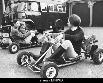 London, UK, UK. 10th Apr, 1969. PRINCE CHARLES, the Prince of Wales, born November 14, 1948, was the heir apparent and is the eldest son of Queen Elizabeth II. PICTURED: Prince Charles riding a go-kart with younger brother PRINCE EDWARD, 5, on Windsor Castle grounds. PRINCESS ANNE is riding a cart in the foreground. © KEYSTONE Pictures/ZUMA Wire/ZUMAPRESS.com/Alamy Live News Stock Photo