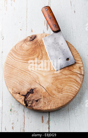 Meat cleaver on blue wooden background Stock Photo