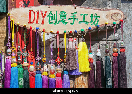 LIJIANG,CHINA - SEPTEMBER 16, 2014: hand made Naxi's souvenirs in the small shop of Lijiang, China on September 16, 2014. Stock Photo