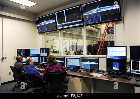 Engineers at NASA Marshall Space Flight Center work on SLS integration, testing avionics, core stage, forward skirt hardware, and spacecraft systems to prepare for future missions, ensuring safety, reliability, and operational readiness. Stock Photo