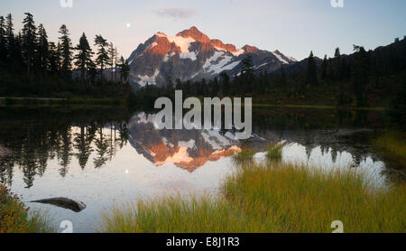 Mt. Shuksan reflected in Picture Lake at sunset. Stock Photo