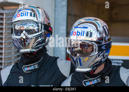 Pit crew in chrome effect helmets at the Le Mans 24hr endurance race 2014, Circuit de la Sarthe, France Stock Photo