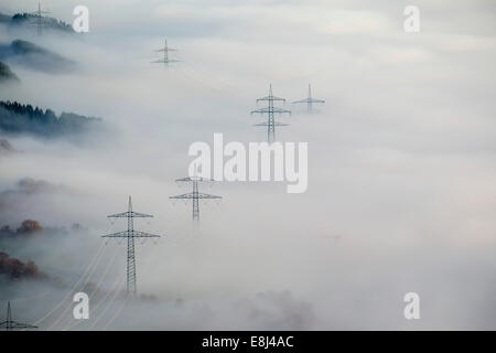 Pylons in the fog, at Bestwig, Sauerland, North Rhine-Westphalia, Germany Stock Photo