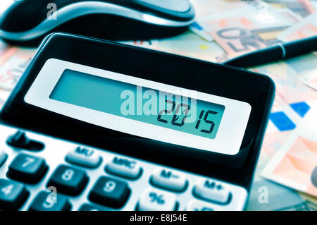 the number 2015, as the new year, on the display of a calculator Stock Photo