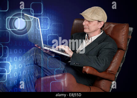 Man sitting indoors using laptop on tech background - clipping path Stock Photo