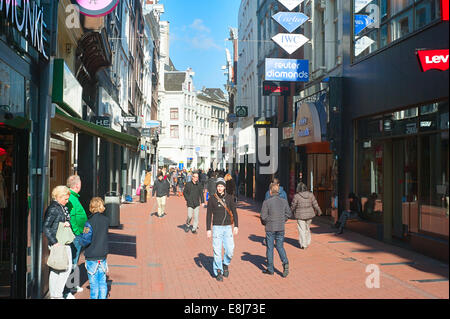 Unidentified people walking on Kalverstraat - main shopping street of Amsterdam. Stock Photo