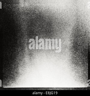 Abstract grained film strip texture. Contains grain, dust and light leaks. Stock Photo