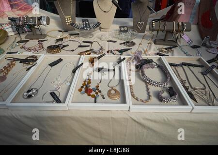 A hand made jewelry stall in Altrincham Market, Cheshire showing original items of costume jewelry Stock Photo