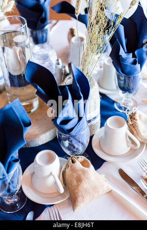 Banquet hall decorated for wedding in white and blue. Stock Photo