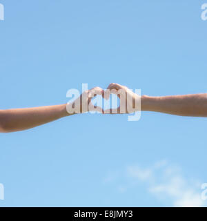 two hands forming a heart Stock Photo