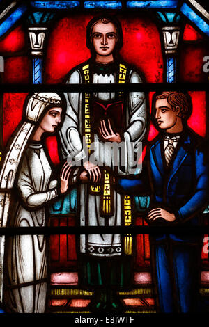 St Barth's church. Stained glass window. Sacrament of Marriage. Stock Photo